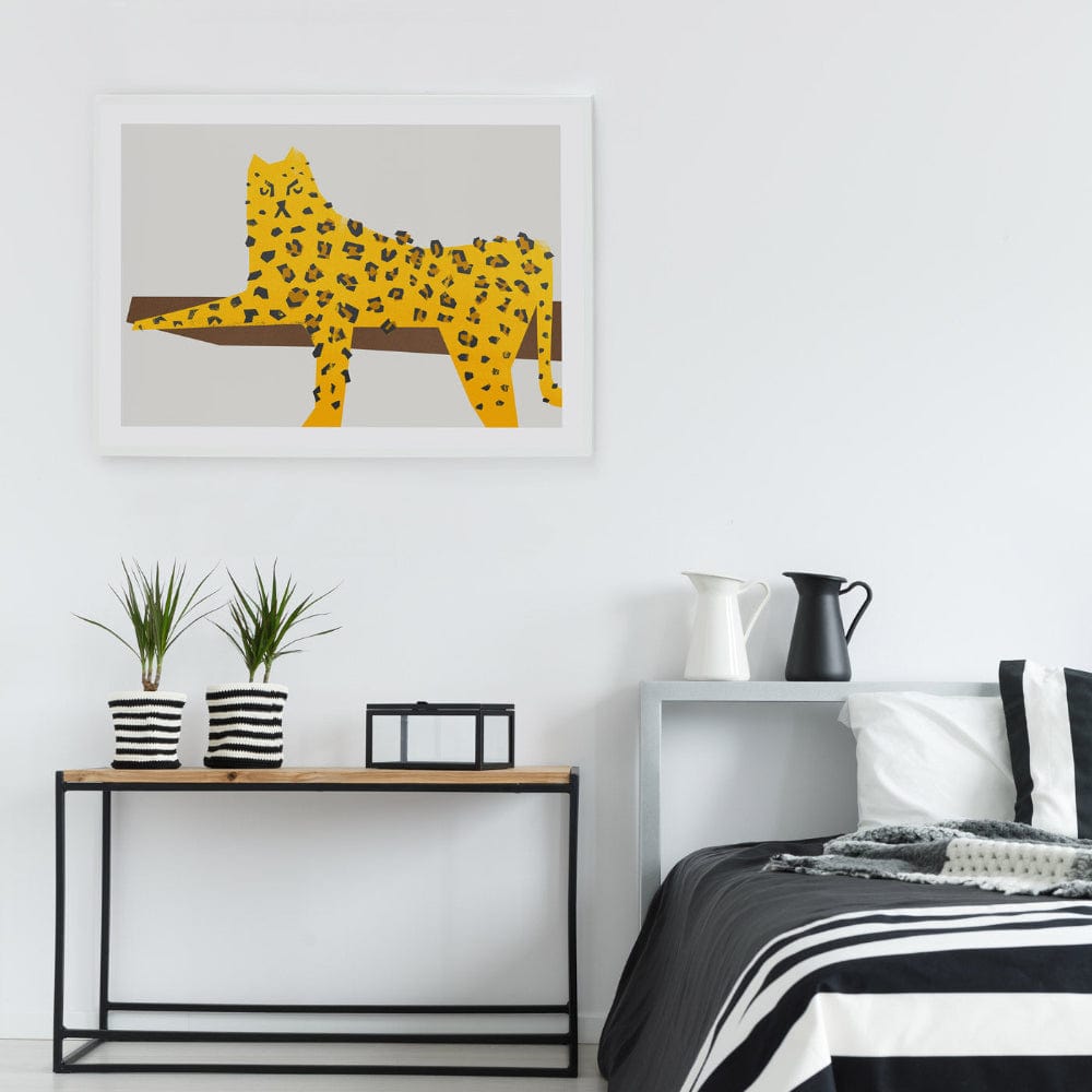 Graphic leopard print displayed above a modern bed, adding personality.