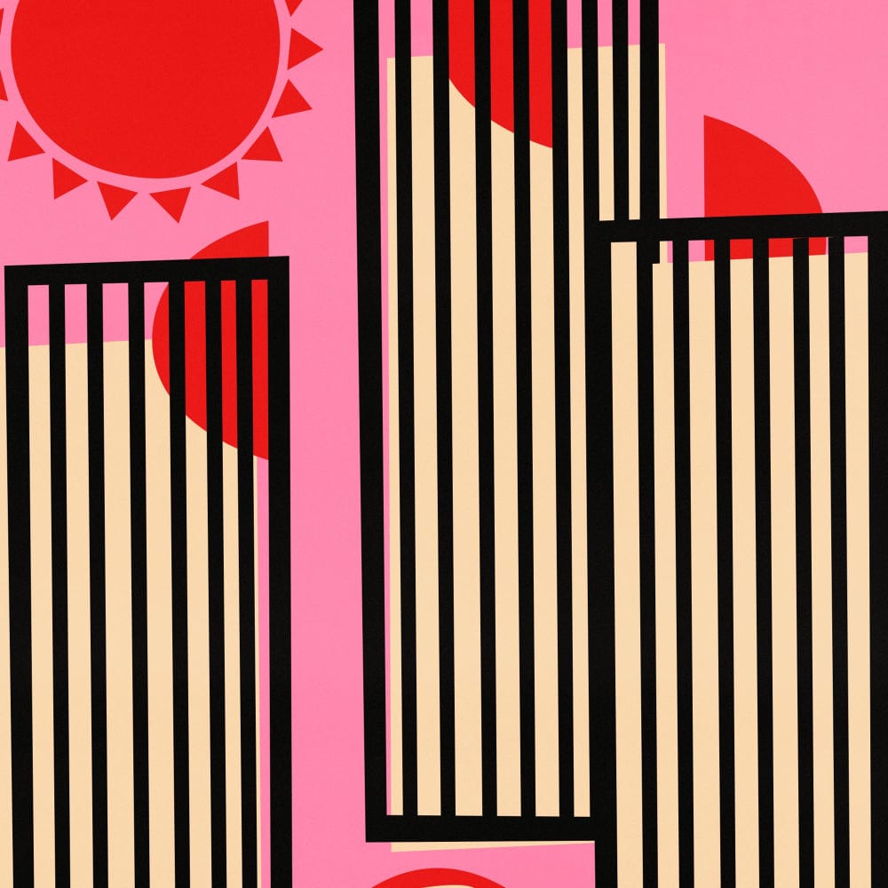 A close-up view showing the vertical black-striped towers, stylised grapefruit slice, and radiant sun motif — celebrating the cocktail’s refreshing character visually.