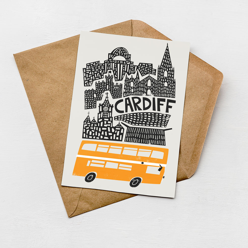 a card with a cityscape illustration and a double-decker bus, all set against a white background.