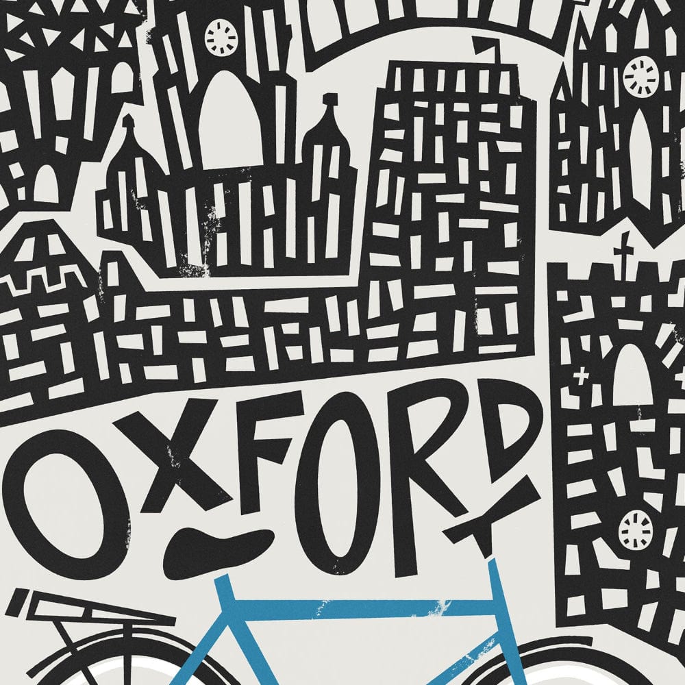 Close-up of the Oxford city print, showing the intricate rooflines of historic colleges and the distinctive typography nestled above a charming bicycle motif.