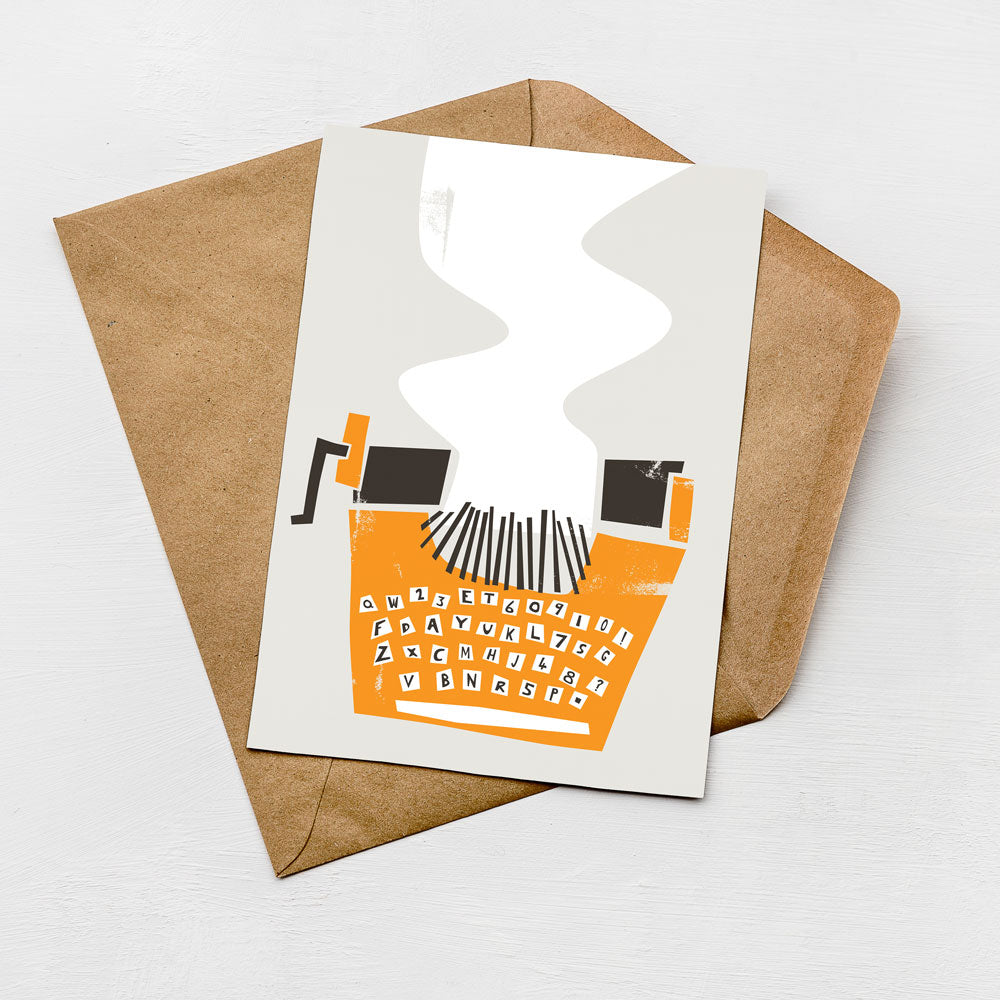 an orange typewriter with the text "QWERTYUIOP" printed on it, placed on top of a brown envelope.