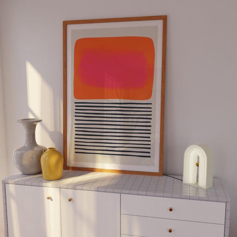 Contemporary print leaning on a cabinet, combining painterly warmth with structured linework
