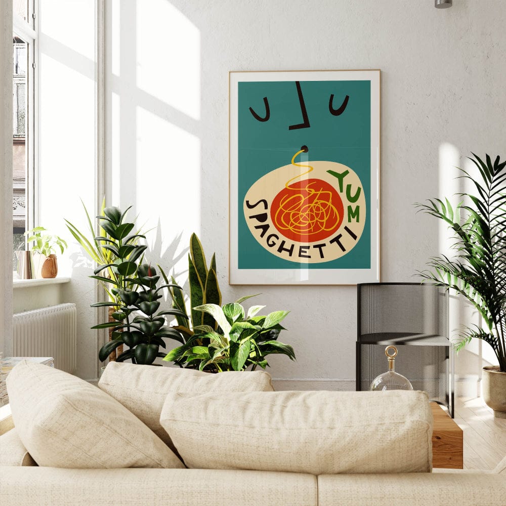 The Spaghetti Yum print on a teal wall in a sunlit living room, adding warmth and personality to the modern furnishings and leafy green decor.