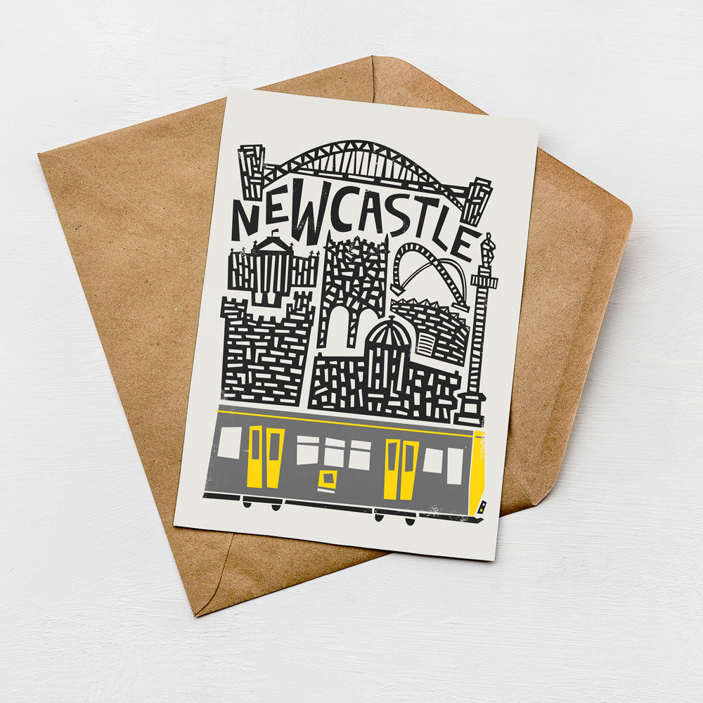 a card with a graphic design depicting a train and the text "NEWCASTLE" written on it.