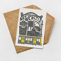 a card with a graphic design depicting a train and the text "NEWCASTLE" written on it.