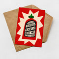 A greeting card with a red background and a graphic of a hot sauce bottle.