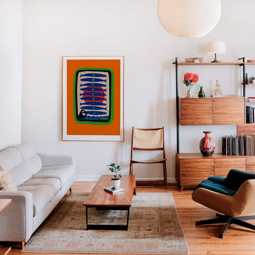 Anchovy print framed in white-walled living room with mid-century furniture and soft lighting