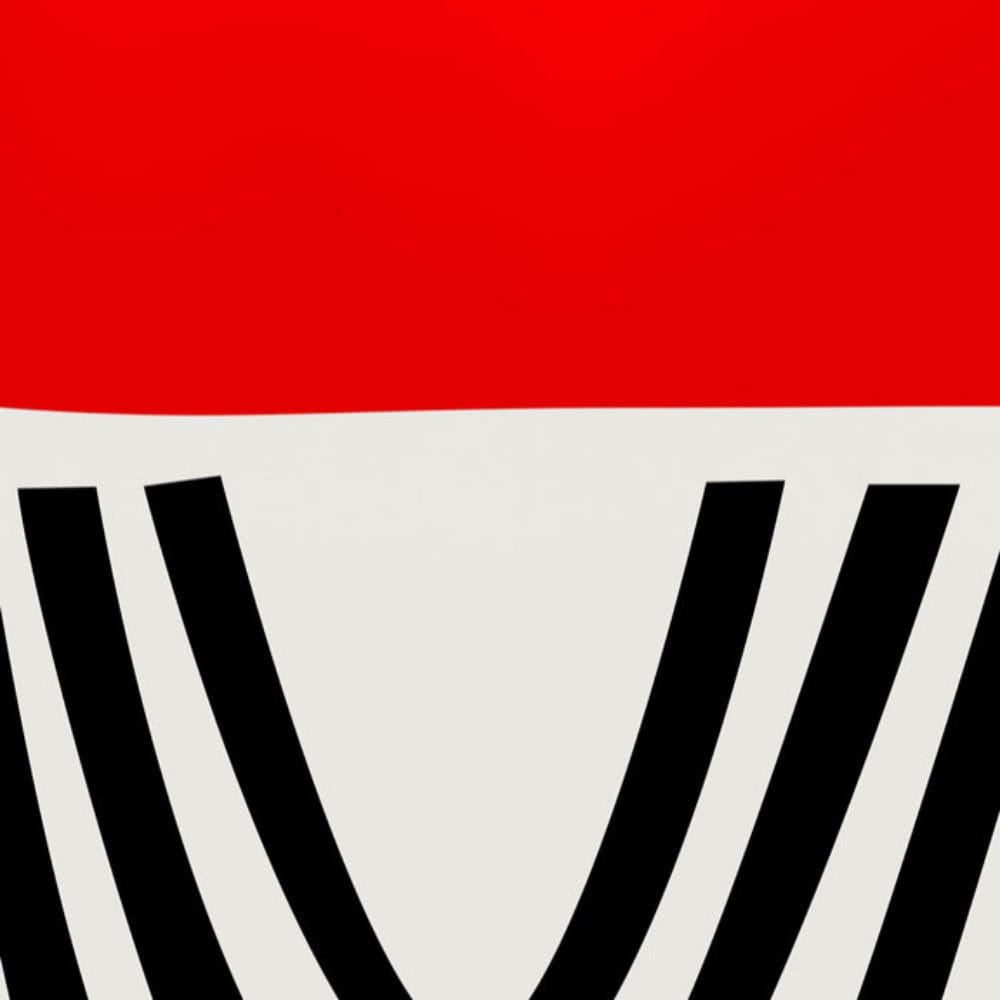 Close-up detail of the red and black arch design, showing clean lines and colour contrast