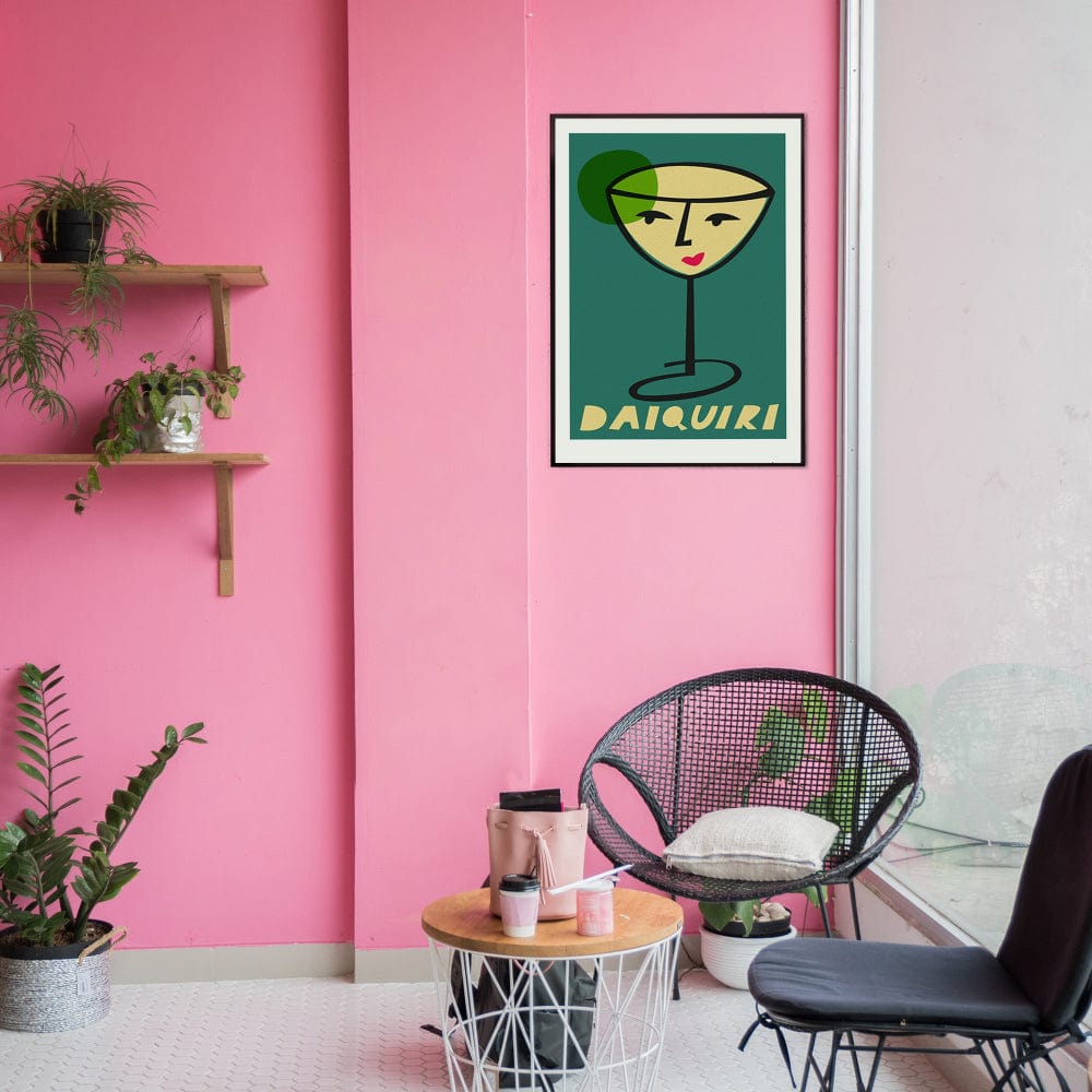 Daiquiri art print framed on a soft pink wall above contemporary furniture, adding a fun contrast to the graphic green tones.