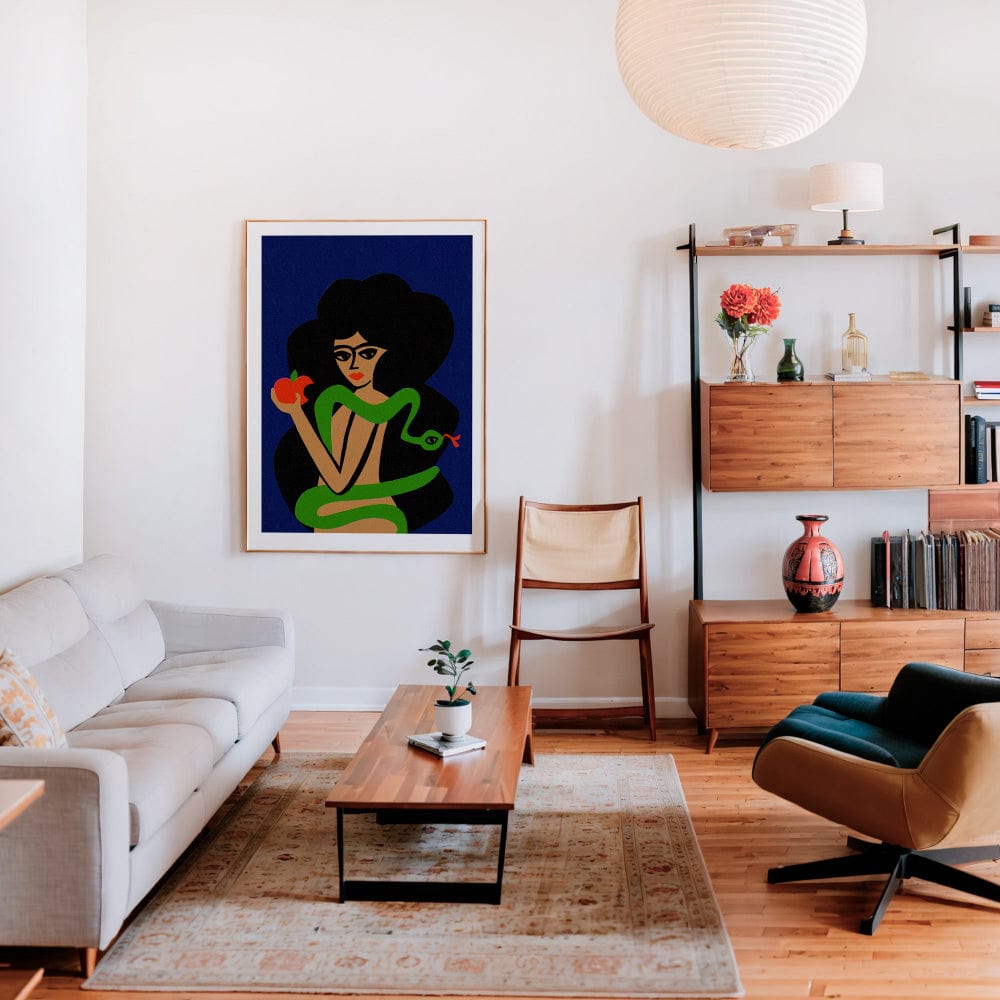 Framed Eve and the Serpent print styled with modern furniture and soft lighting in a cosy living room