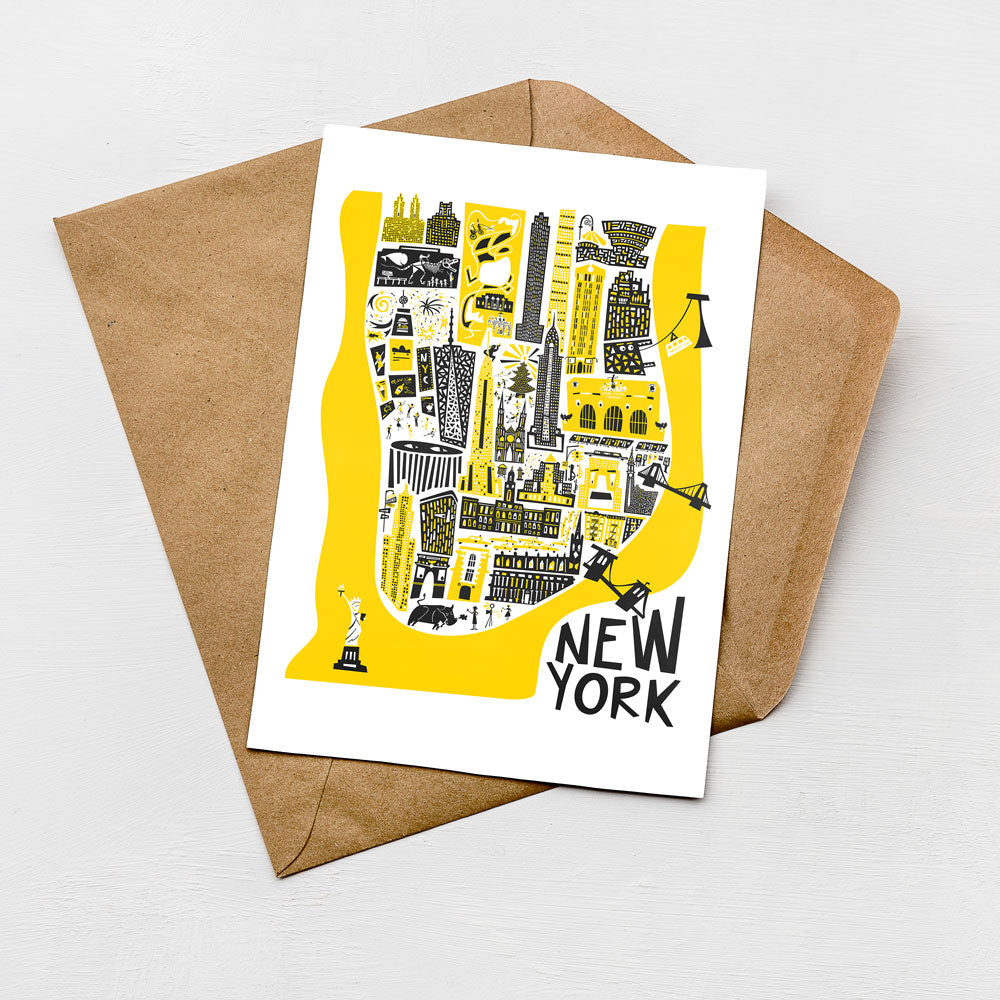 A colorful illustration of New York City on a card, with various landmarks and symbols depicted in yellow and black.