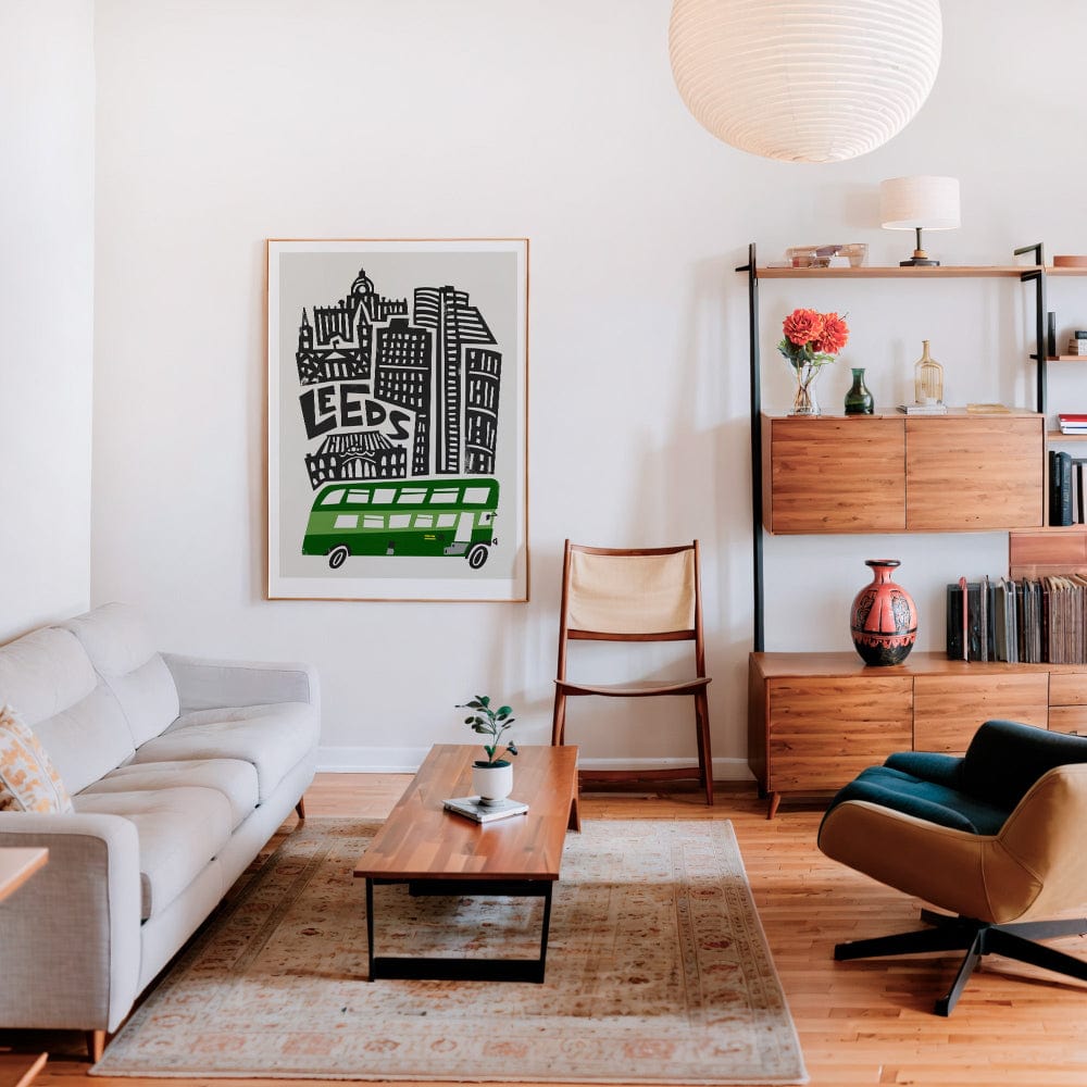 Framed Leeds city print on the wall of a contemporary living space, styled with warm wood tones and modern furniture, bringing in urban personality and vibrancy.
