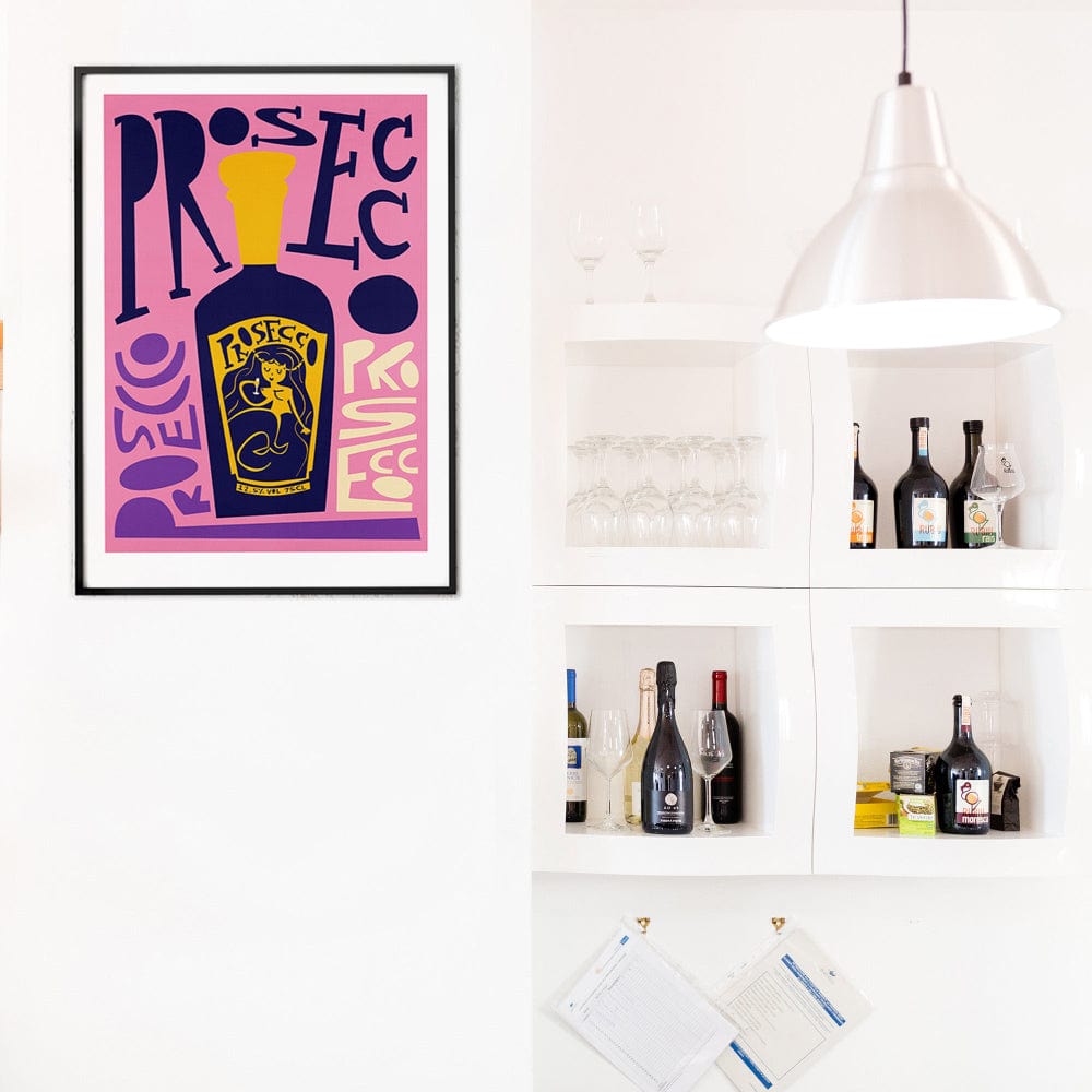 Statement prosecco art print displayed in a contemporary kitchen bar area with wine shelving.