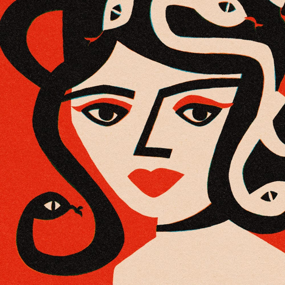 Close-up of Medusa’s stylised face with piercing eyes and bold black snake hair.