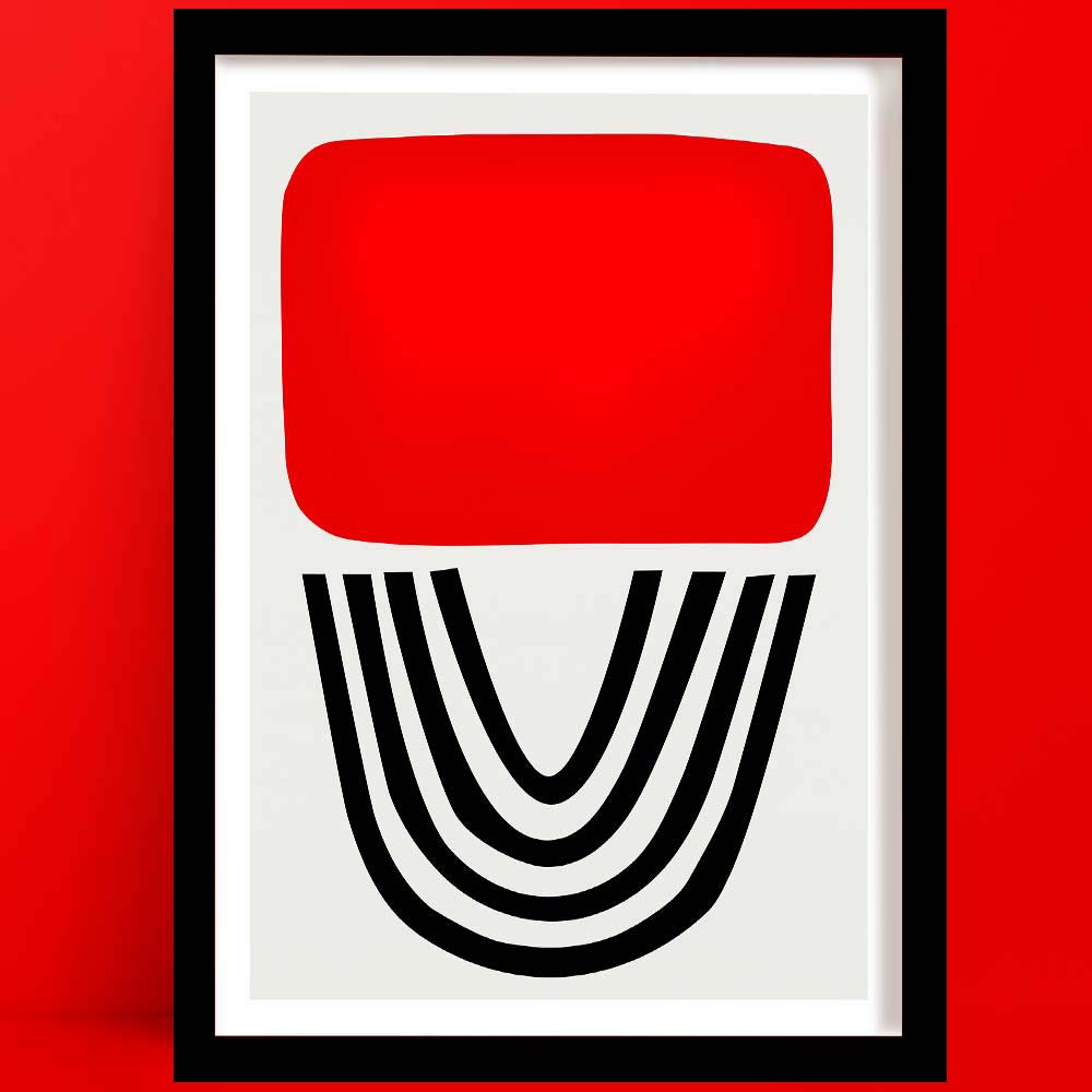 red lipstick abstract art print is a Bold abstract with red block and black arches, framed and set against a matching red wall.