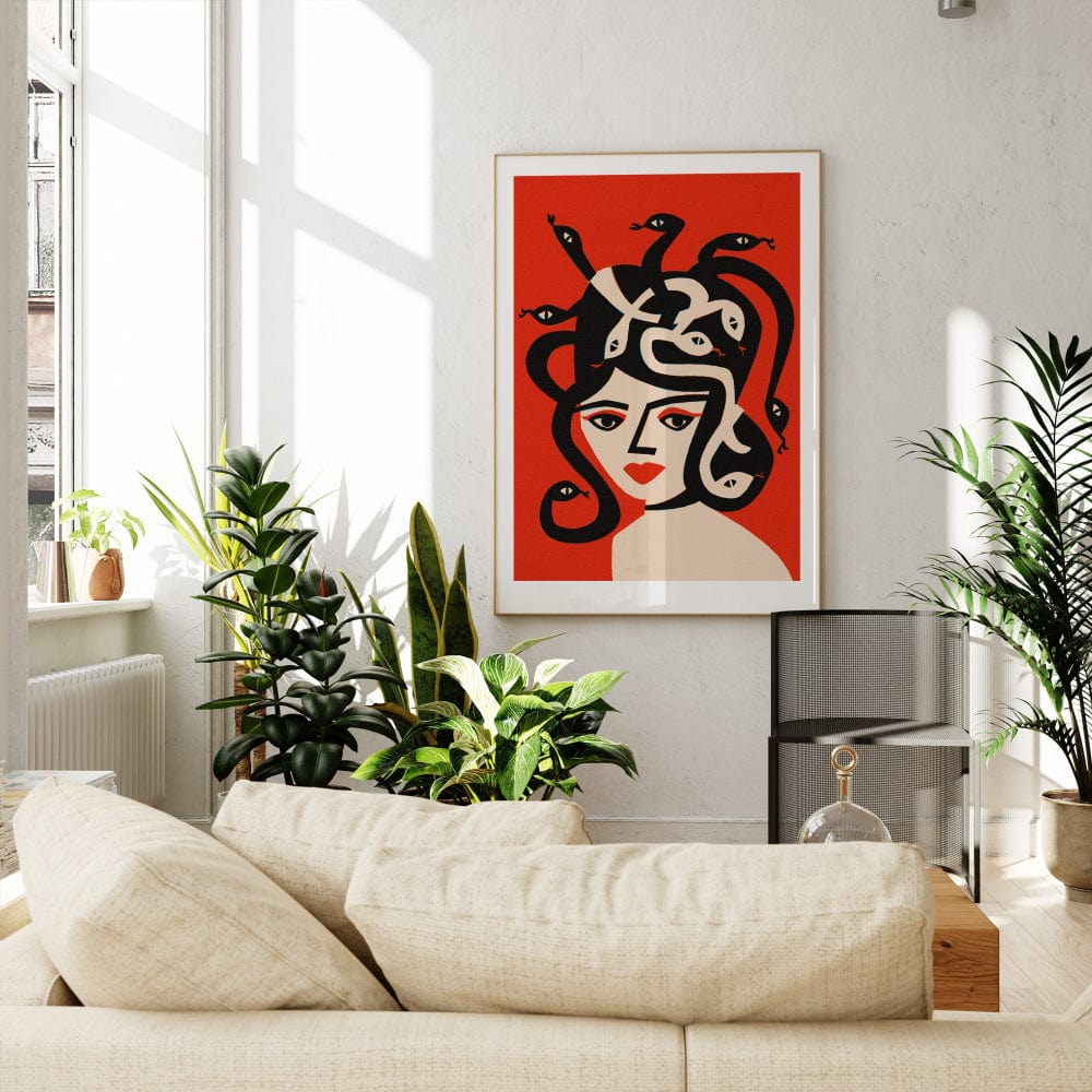 Medusa artwork framed on red wall in a bright living room with cream sofa and leafy plants
