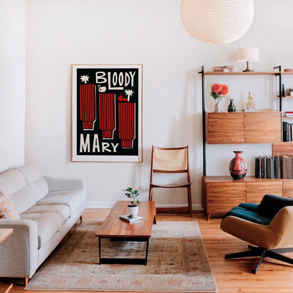 The Bloody Mary print framed and styled in a modern living space, its black background and red accents adding dramatic flair to a mid-century inspired interior.