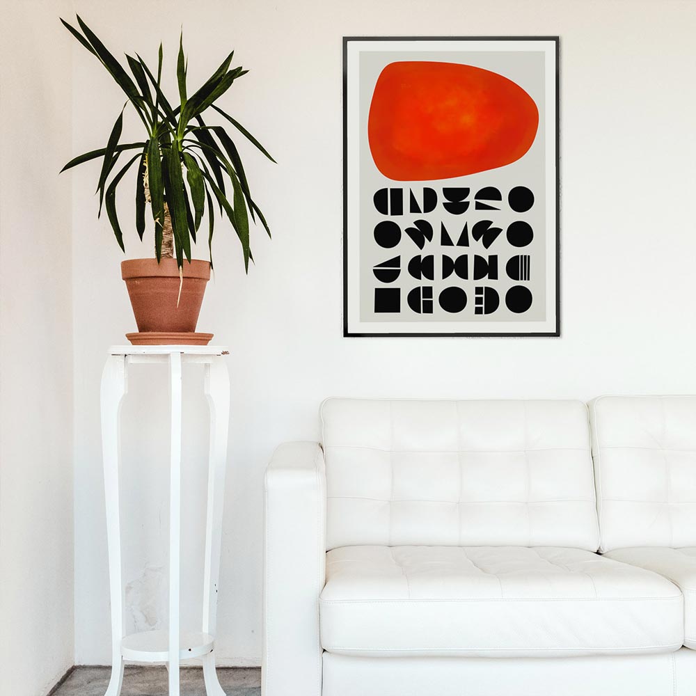 Modern interior with a white sofa, plant on a small table, and abstract art print on the wall.