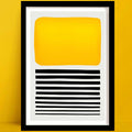 Sticks in the Sand abstract art print a bold abstract print with yellow block and black stripes, framed and set against yellow wall