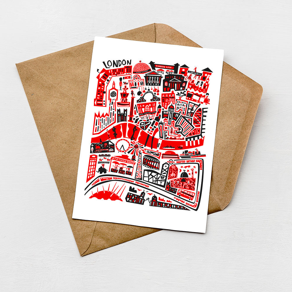 A colorful illustration of London on a card, featuring various landmarks and city elements in red and black.