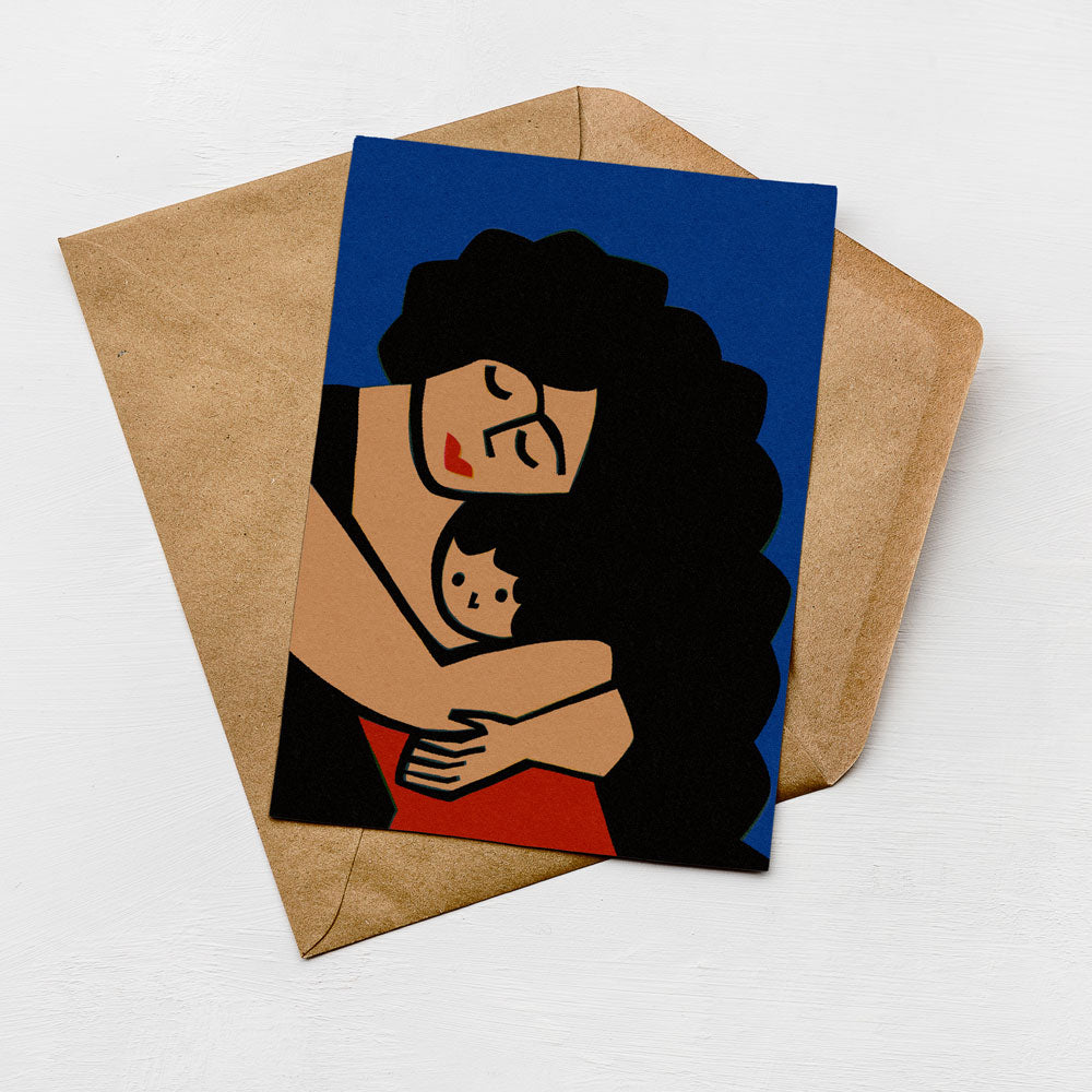 A greeting card with a stylized illustration of a woman embracing a child, set against a blue background.