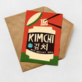 A greeting card with a red background and a black and white illustration of a container with a green lid, along with text in Korean and English.