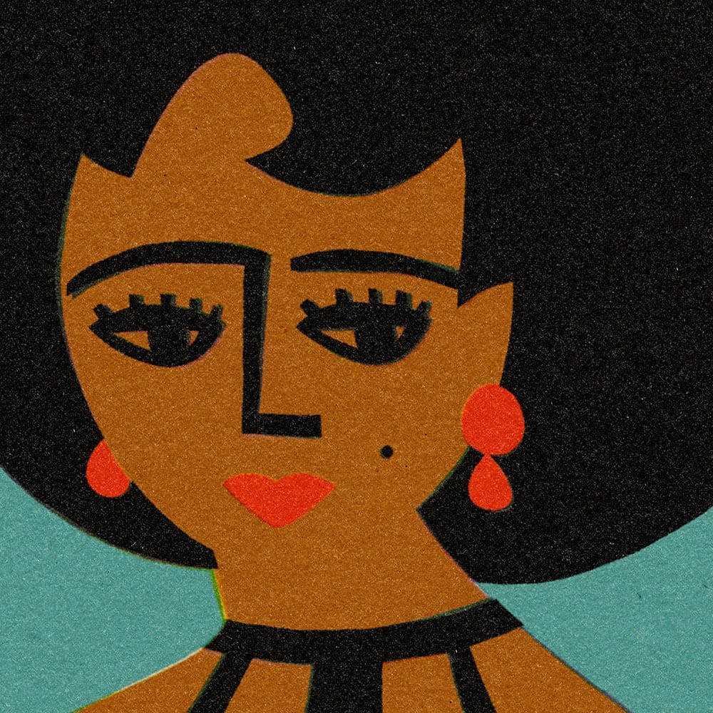Close-up of stylised woman with graphic lashes, hoop earrings and voluminous black beehive