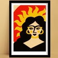 Sun Goddess print in black frame, bold retro portrait with sunburst hair and warm tones.