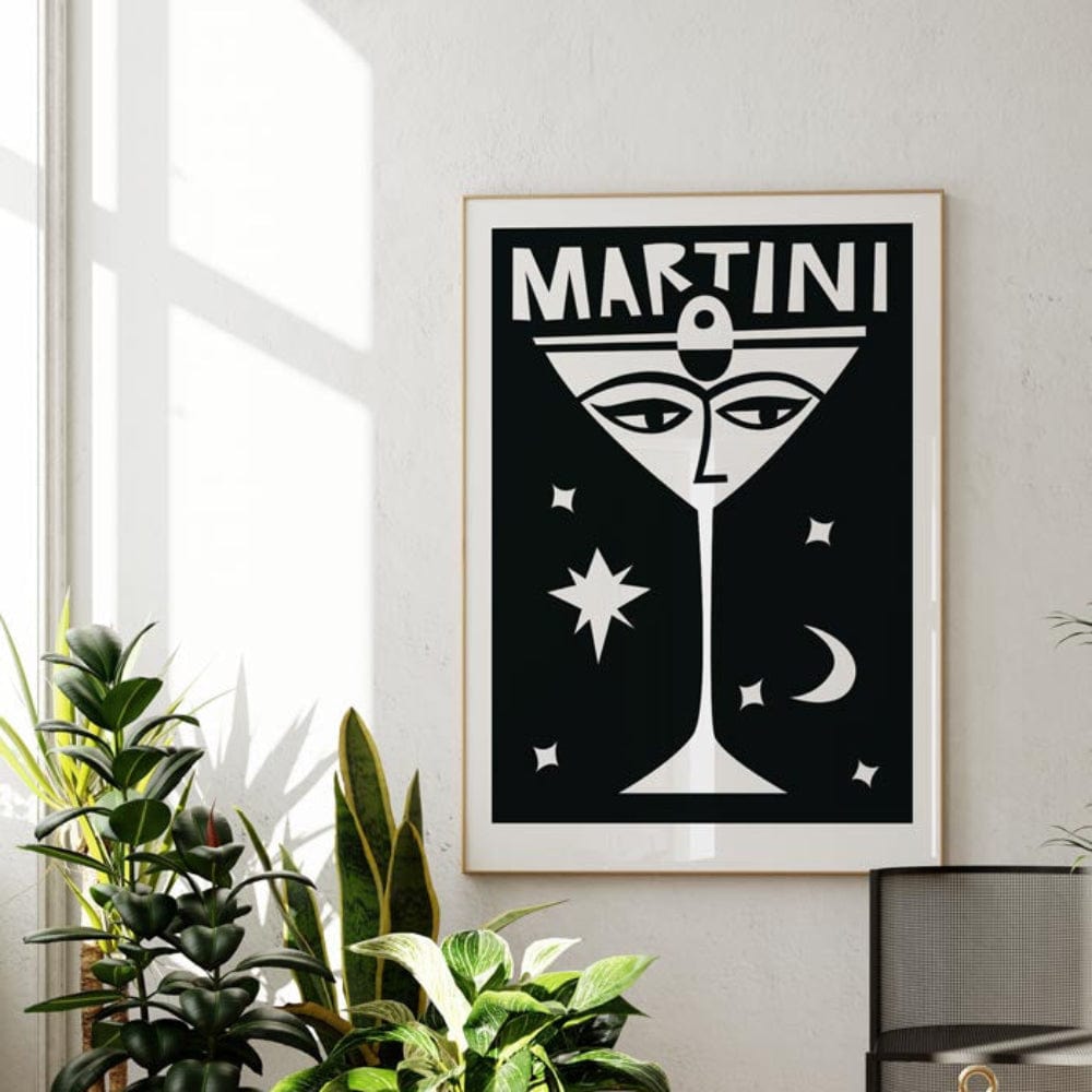 Martini print hung in a light-filled room; its bold monochrome palette contrasts beautifully with the serene white walls and natural light.