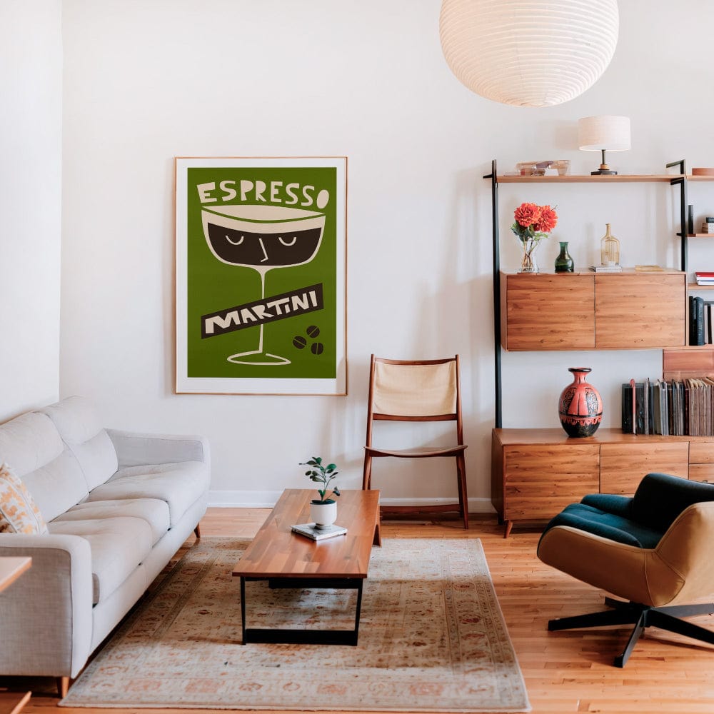 Espresso Martini print hanging in a stylish living room with a white sofa, wood shelving, and soft ambient lighting.