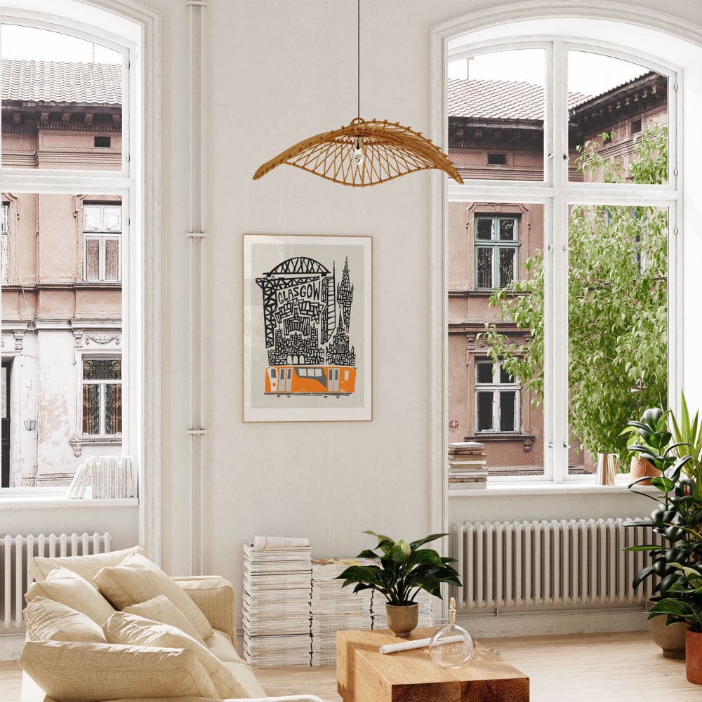 Glasgow illustration displayed in a bright, elegant living space, where warm sunlight enhances the orange subway detail and the dynamic architecture of the print.