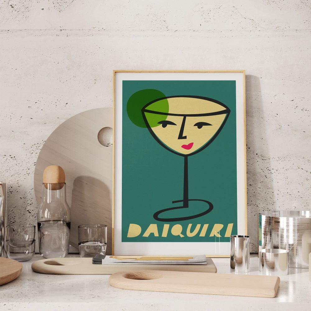 Daiquiri cocktail print framed on a stone-textured kitchen shelf beside glasses, creating a modern bar-inspired nook.