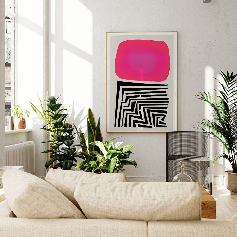 Statement abstract print bringing energy to a natural living space filled with plants and soft light.