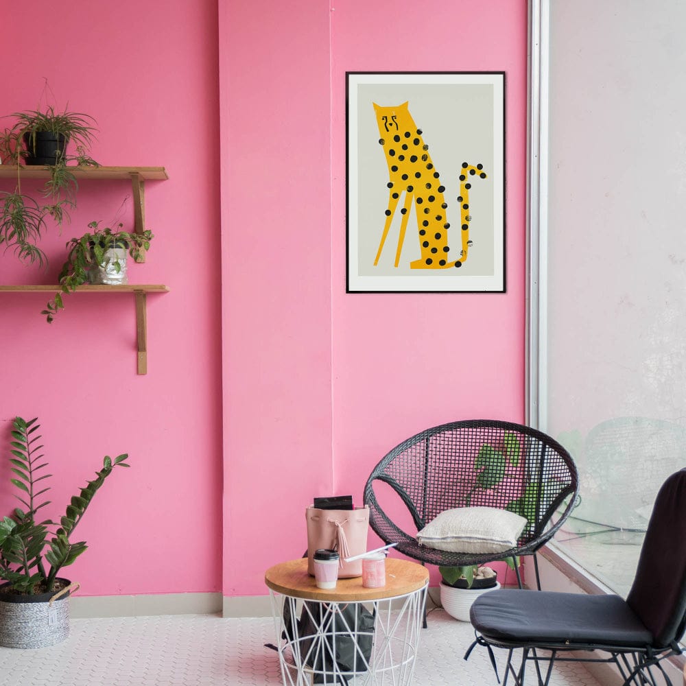 The cheetah print pops against a playful pink wall in a modern setting, paired with sleek furniture and greenery for a fun, art-forward vibe.