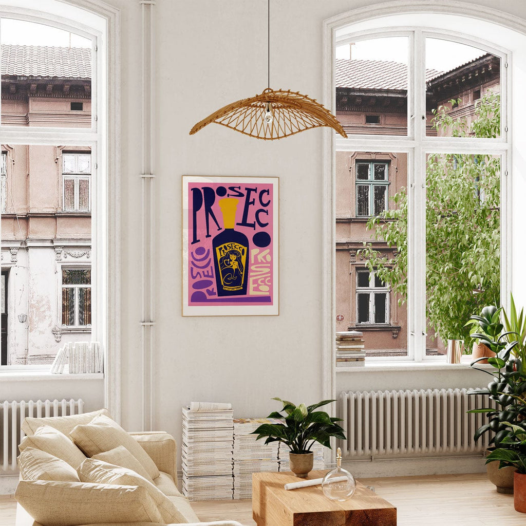 Graphic prosecco bottle print adding a splash of colour and character to a bright, plant-filled lounge.