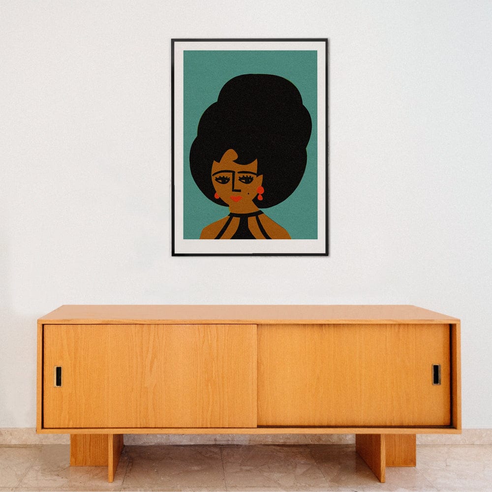 Beehive hair portrait print framed above minimalist wooden console in light-filled modern room