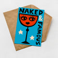 A greeting card with a stylized illustration of a wine glass and the text "Naked & Famous" on it, placed on a brown envelope against a white background.