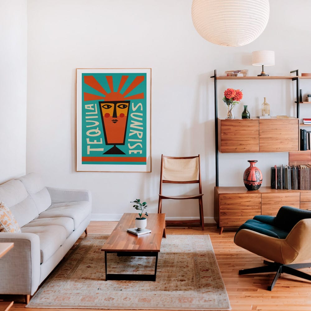 Tequila Sunrise artwork framed in a mid-century inspired living space with warm wood tones and soft lighting