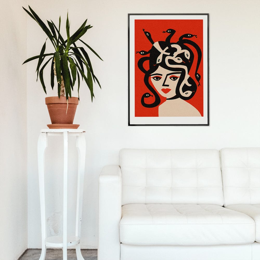 Medusa print framed above white sofa, styled with tall potted plant in modern room