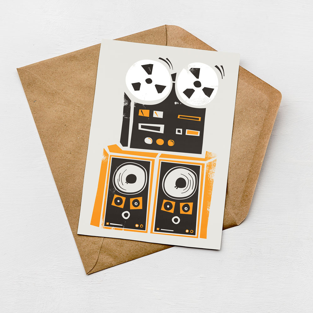 a card with a graphic design of a vintage audio equipment, including a turntable and speakers, placed on top of an envelope.