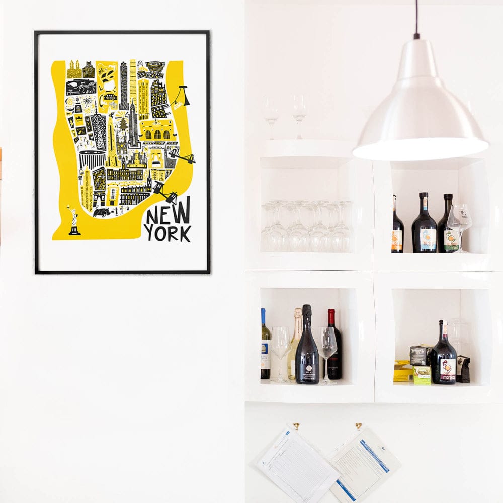 The yellow New York city map print hanging in a contemporary kitchen space, providing a vibrant contrast against white tiles and modern shelving.