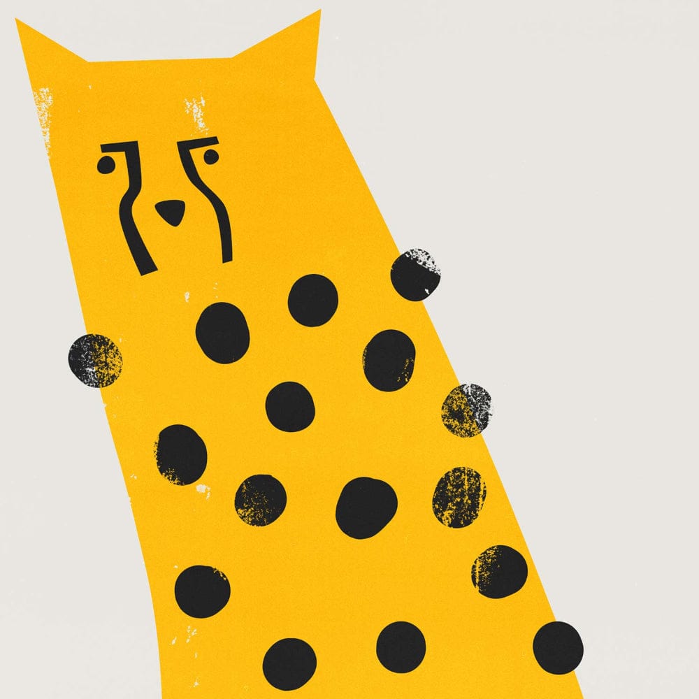 Close-up of the yellow cheetah print showcasing expressive linework and contrast between the mustard yellow body and bold black spots.