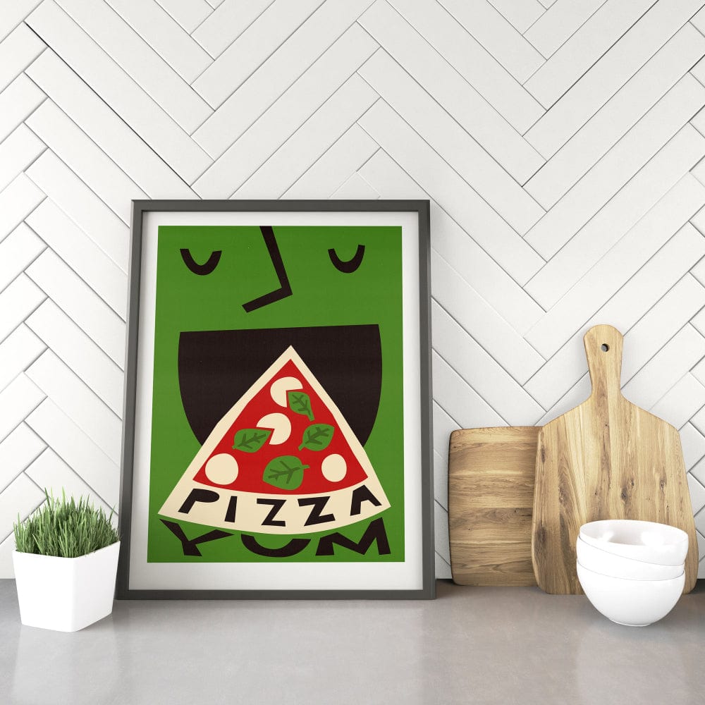 Pizza artwork leaning against white kitchen tiles with chopping boards and ceramics — a fun addition to culinary spaces.