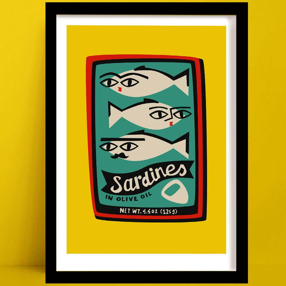 Sardines print featuring illustrated fish with faces inside a red tin, framed on yellow wall.